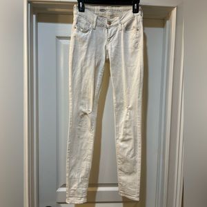 Old Navy low rise Rock Star distressed white jeans. Size 0